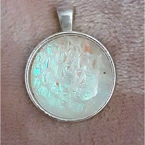 Luminous silver tone round 1.5" glass pendant honey comb background